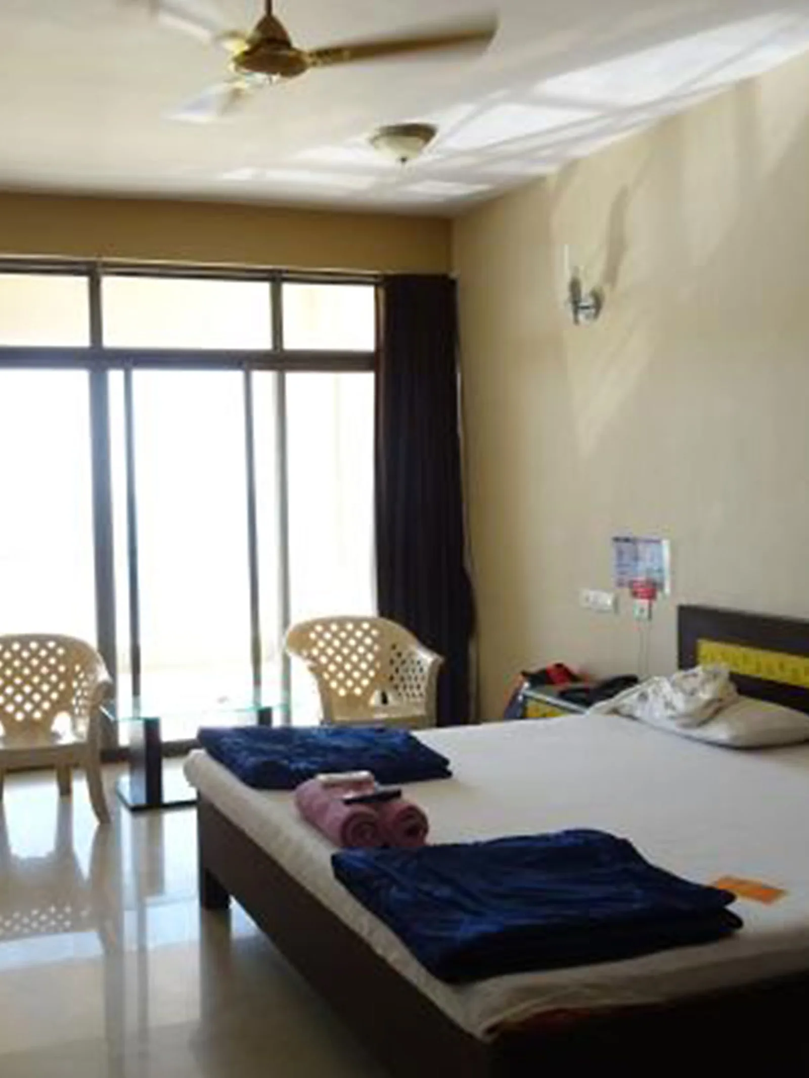 Family room with two beds made up with white linen